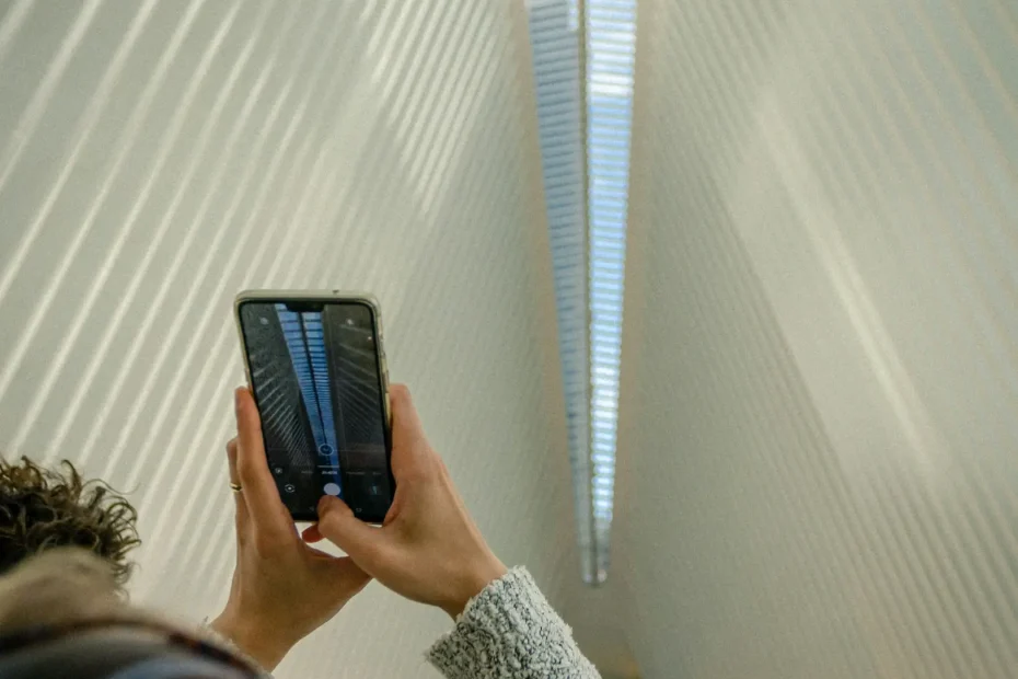 person taking picture of building interior